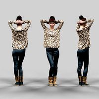 Girl posing in tigerprint clothing and leather