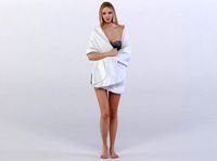Janna 0366 Woman standing wrapped in a towel