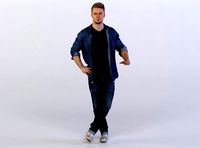 Leo 0048 Man in a denim shirt resting on invisible table, legs crossed