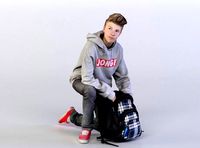 Brad 0052 Kid knealing down over backpack
