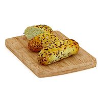 Buns with Sesame Seeds on Wooden Board