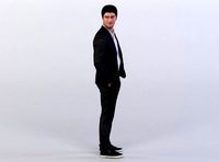 Berkan 0111 Man in a Suit standing, Looking over his Shoulder