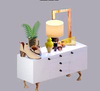 modern buffet including lamp plant and more