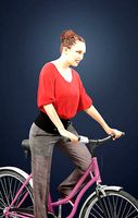 Dream A Female Model in A Red Blouse Riding A Bicycle Red