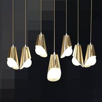 Hanging cocoons of brass and crystal