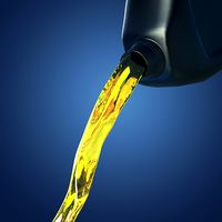 Motor oil pouring from canister
