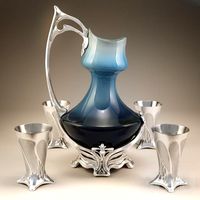 Art nouveau pitcher with cups