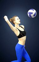 Beauty Attractive Sports Woman Smashing in Volleyball