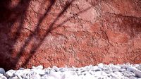 Red damaged plaster wall textur