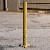 Yellow parking post (bollard)