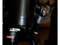 Holding arm for bicycle front light