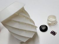 Helical rain/radiation shield for weather sensors with sensor mounting
