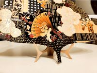 Decorative vertical holder for frame or plate