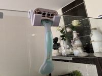 female razor holder for shower wall