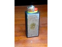 Bic lighter holder for tamper plate