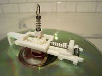 CD gripper for a CD changer
