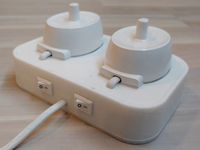 Oral-B charging station switchable toothbrush holder