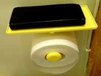 Toilet paper holder with phone holder