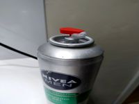 Shaving cream bottle nozzle