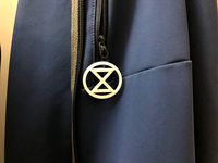 Extinction Rebellion Badge with concealed eyelet