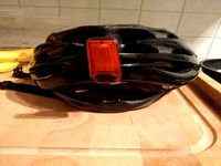 Bicycle helmet light holder