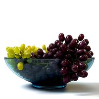 Bunches of grapes in a glass bowl