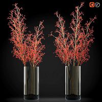 Decorative big branches with red berries in a glass vase