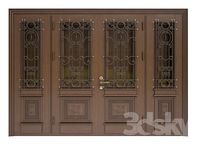 Front door with carvings and forged elements