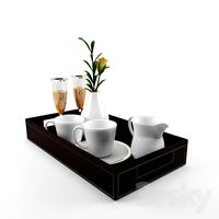 A tray of dishes and a flower