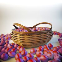 Plums in a wicker basket