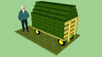 Garden tractor hay wagon with small bales of hay