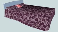 Cama con colcha.