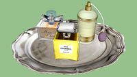 Parfums on a Silver Plate.