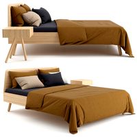 Wooden bed with linen cover
