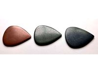 Metal Guitar Pick by geoffreyyoung