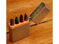 Insert for holding screwdriver bits in a lighter by darkmidnight