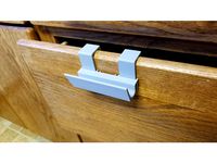 Hanging drawer handle by Patsiecki