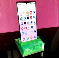 Smartphone Stand with Sound Boost and Chargecable slot by christinloehner