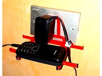 Porta cellulare attaccato alla presa / Mobile phone holder hanging on the plug by vidatox