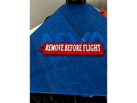 The Remove Before Flight Tag Keychain by dForlithe