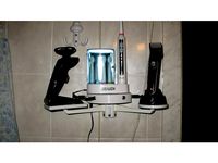 Bathroom shelf with chargers by ncrmnt