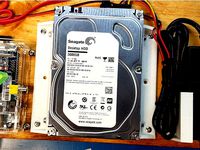 Bracket: 3.5" hard drive to wood panel by tkbletsc