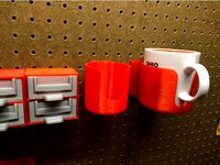 Pegboard mounted coffee cup holder by NerdAlert3D
