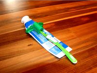 Paste Pusher with Toothbrush Holder by JPodioCuervo