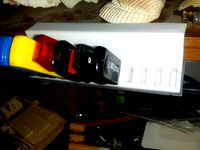 USB holder on edge of shelf by Pyrotron