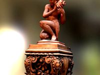 Fisherboy putting a shell to his ear by GeoffreyMarchal