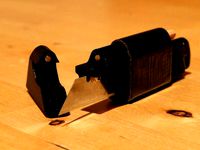 Multi-purpose survival utility knife with a knife, a lighter, a pencil and some duct-tape by Frankenwaeldler