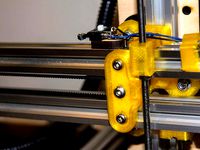 X-idler Mount Plate with X-axis belt tensioning for Makerfarm i3v 10" by GeoDave