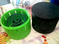 Mosquito coil support and enclosure by Patola