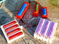 Flexing battery holders with integrated spring by enif